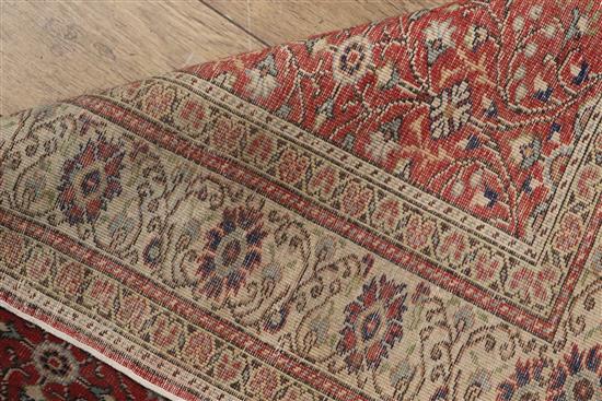 A Turkish Kayseri brick red rug 295 x 204cm